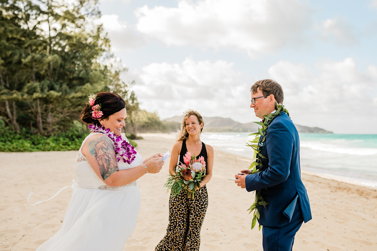 bride and groom eloping in hawaii on a beach