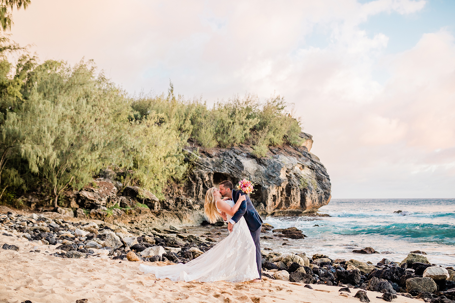 bride and groom kissing while eloping in Hawaii
