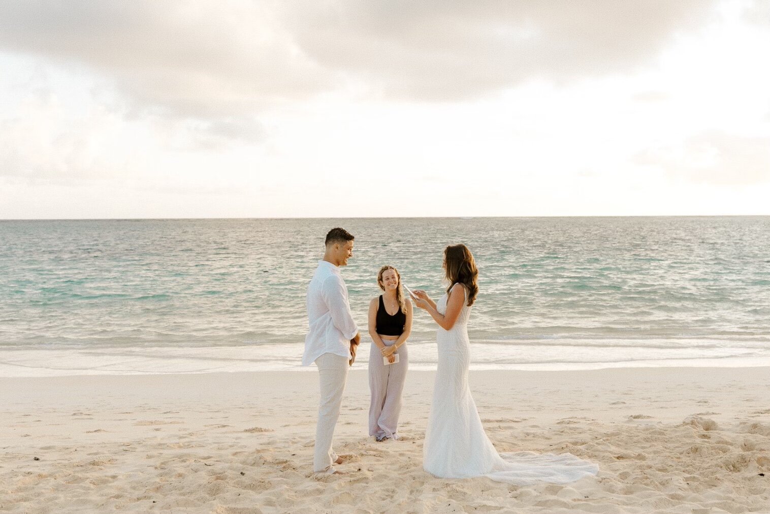 Bride and groom getting married in hawaii on the beach