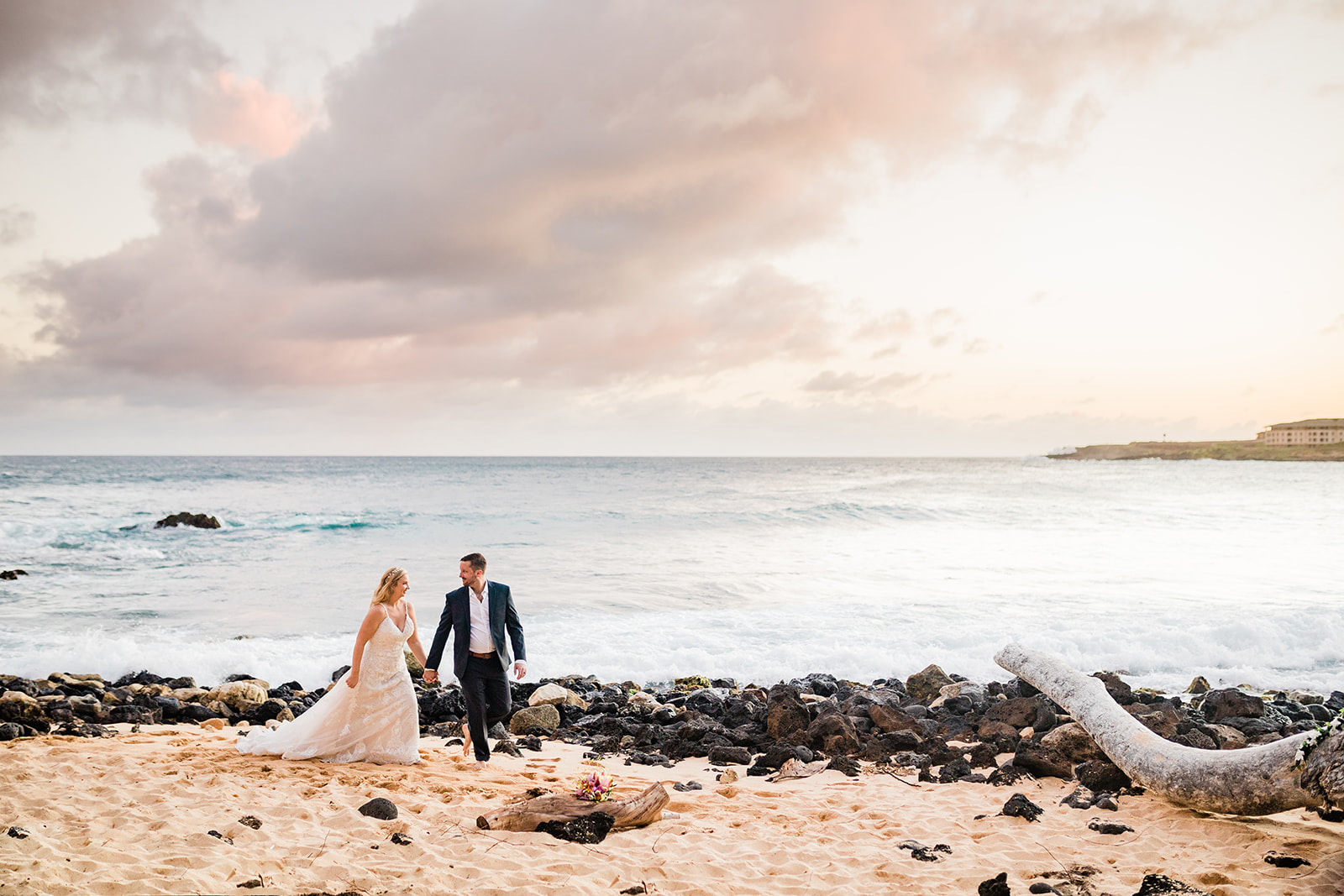 bride and groom getting married in hawaii on the beach