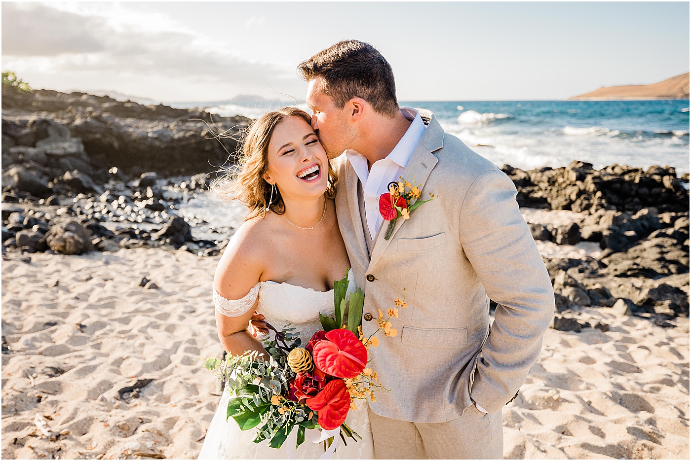 groom kissing bride after wedding in hawaii