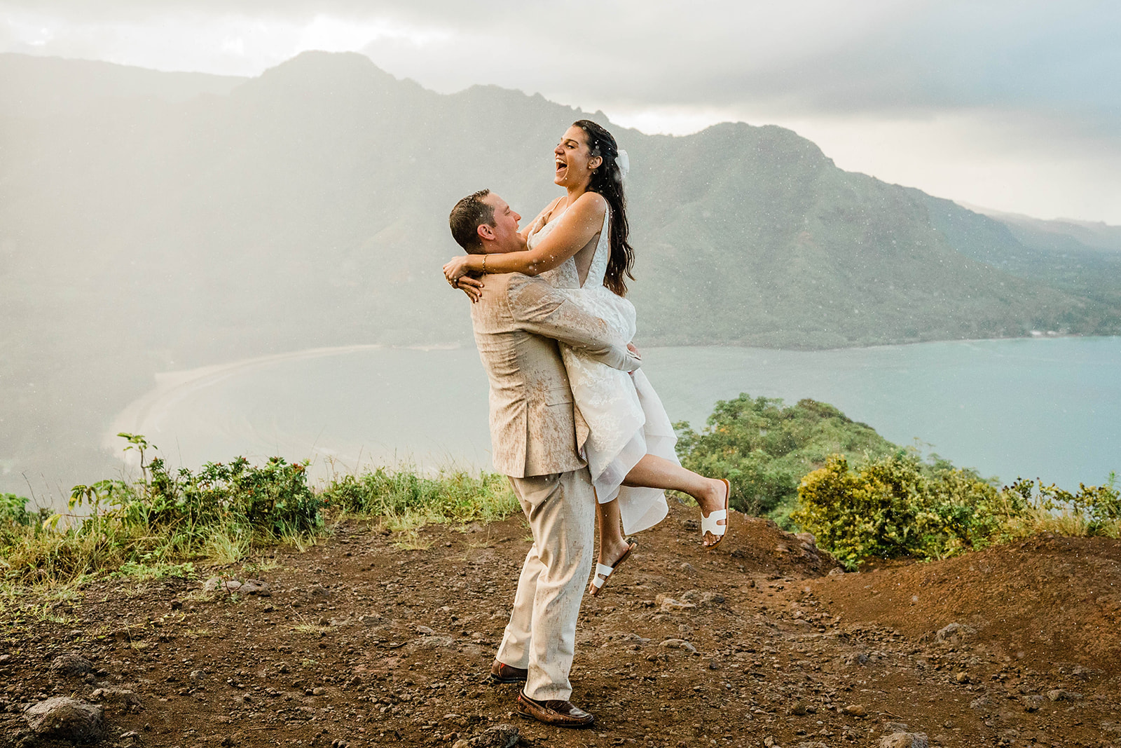 bride and groom in the rain during a hawaii elopement