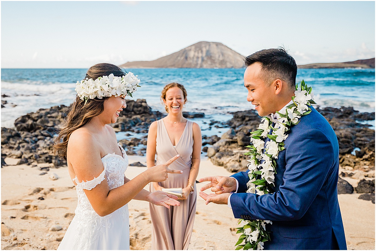bride, groom, and officiant in hawaii beach wedding