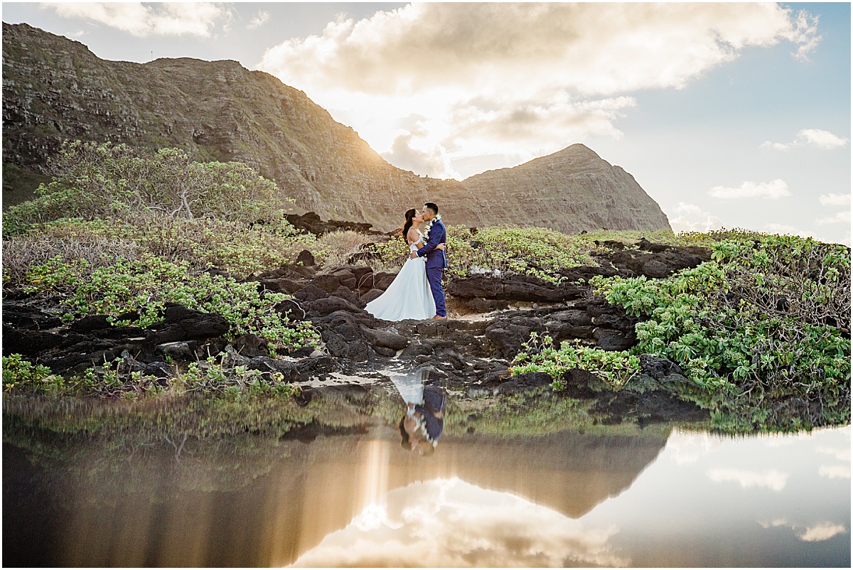 bride and groom kissing hawaii beach wedding