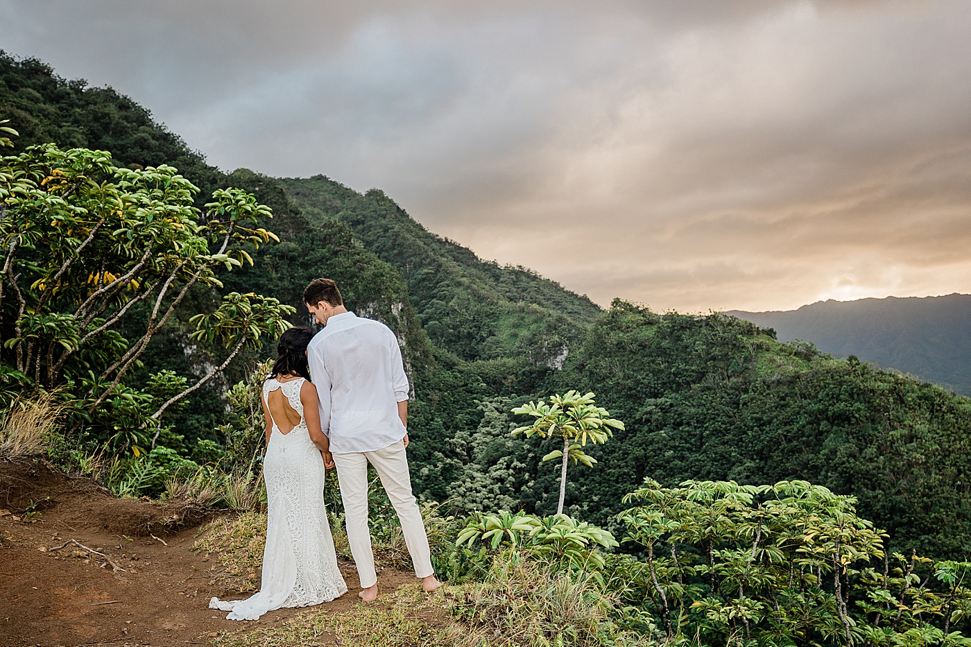 bride and groom during hawaii adventure ceremony on a hike