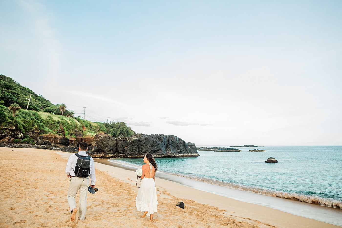 Haleiwa elopement bride and groom walking to ceremony